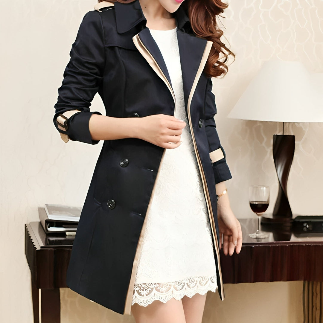 Chic women's double-breasted trench coat with wide lapels and belt, perfect for elegant fashion.