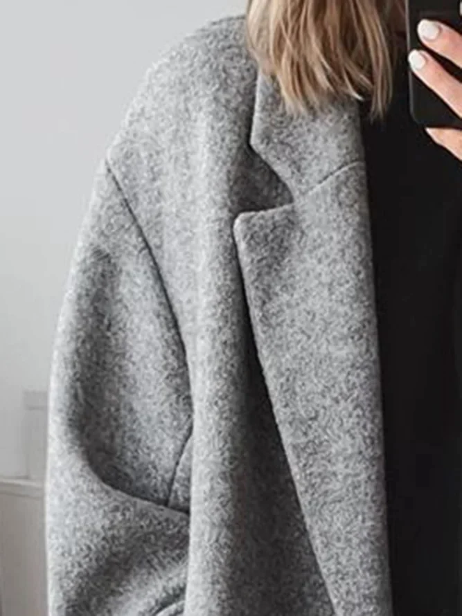 Chic women's brown classic tailored overcoat, long design ideal for warm autumn & winter outerwear.