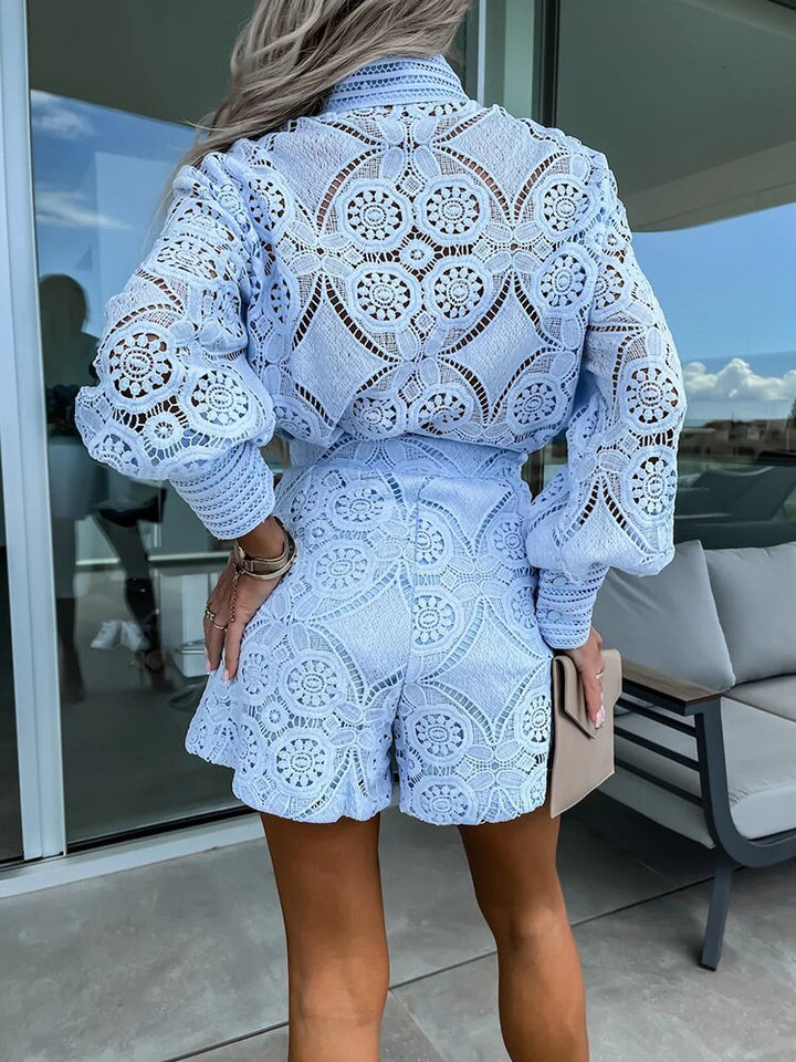 Modern women's summer outfit: chic long sleeve blouse & high-waist shorts co-ord set.