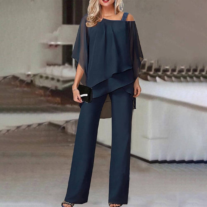 Women's elegant cold shoulder jumpsuit, a flattering one-piece outfit perfect for sophisticated evening wear or events.