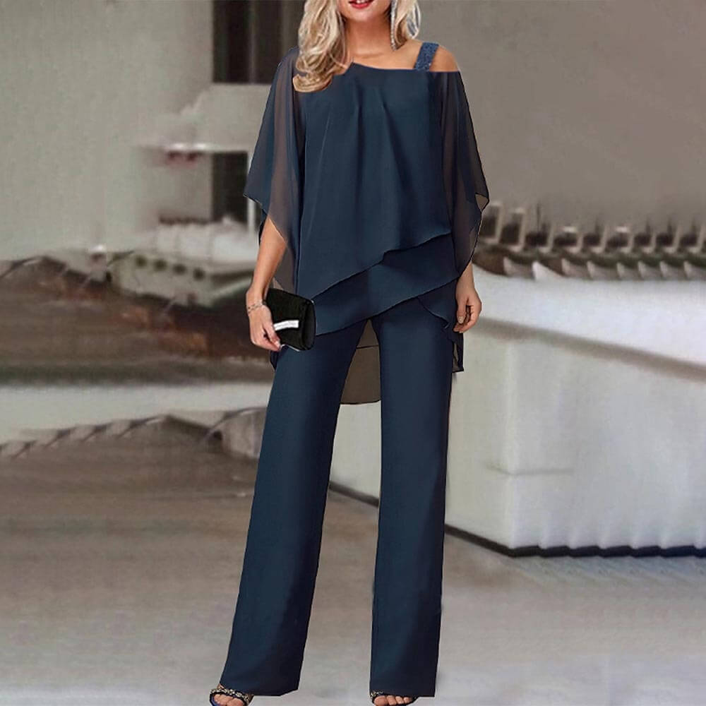 Modern women's cold shoulder jumpsuit in a vibrant color, offering elegant style and comfort for any occasion.