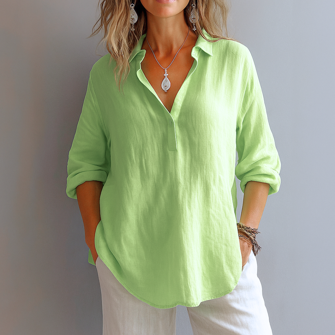 Stylish women's long sleeve collared top, ideal for business casual or elegant everyday wear, featuring a button placket.