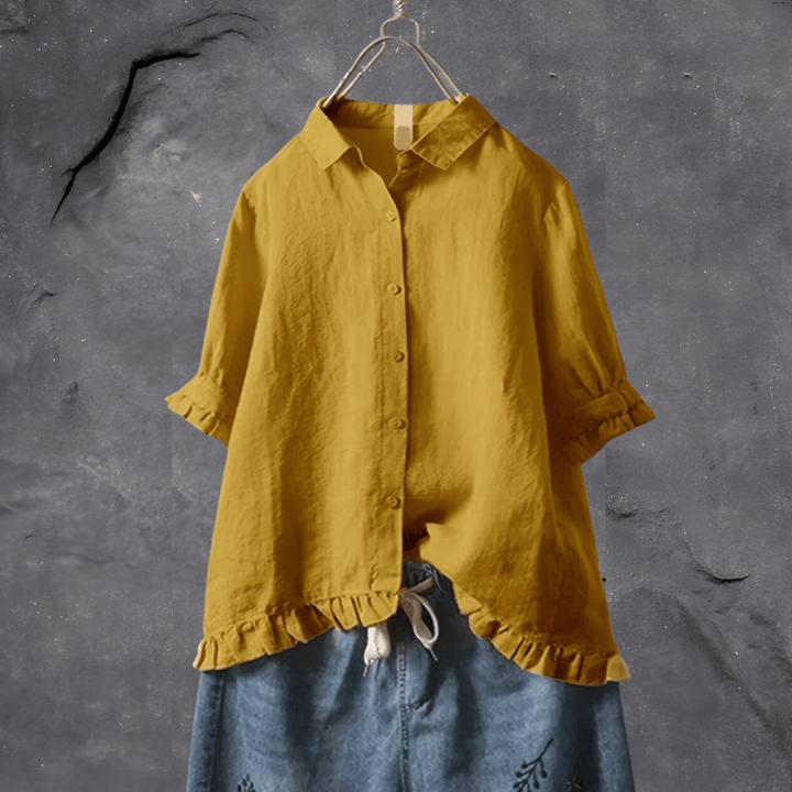 Elegant women's collared blouse with short sleeves, button front, and chic ruffled hem for office or casual wear.