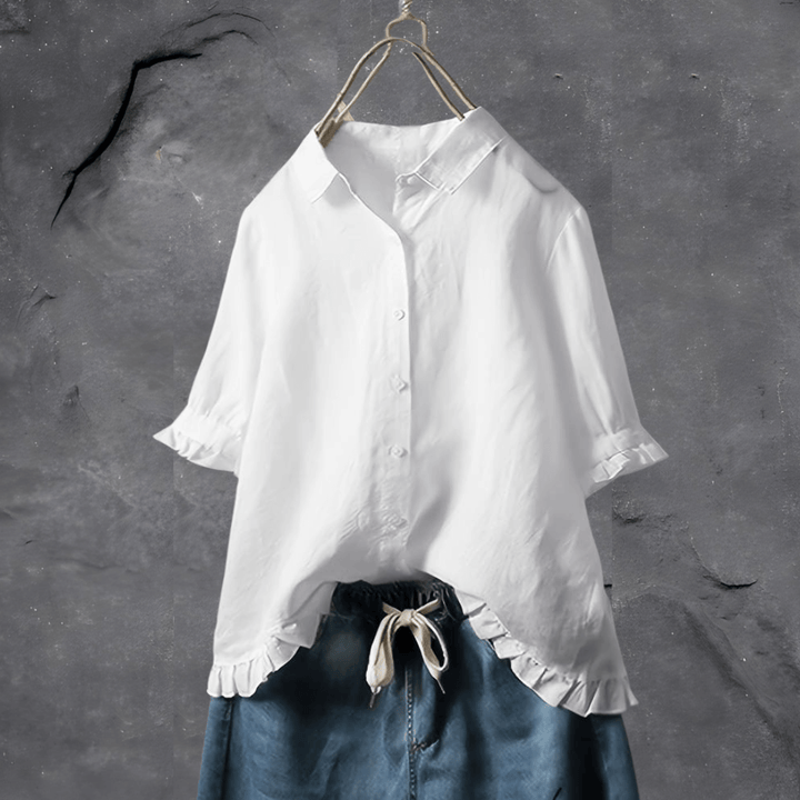 Plus size women's button-front collared top, featuring short sleeves and a fashionable ruffled hem design.