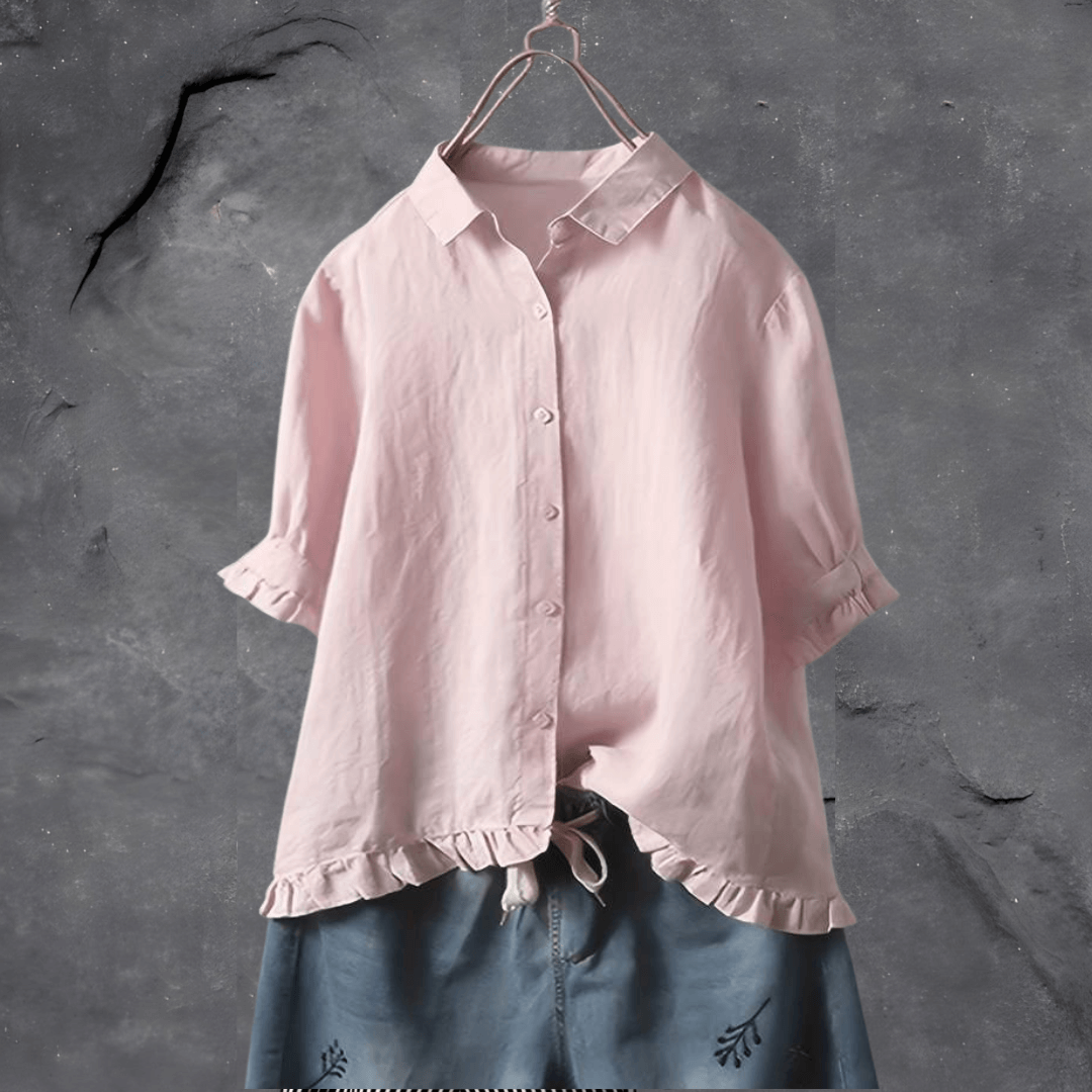 Stylish women's short sleeve collared blouse, button front, and ruffled hem for a versatile casual or office look.