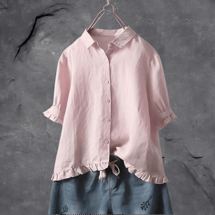 Stylish women's short sleeve collared blouse, button front, and ruffled hem for a versatile casual or office look.