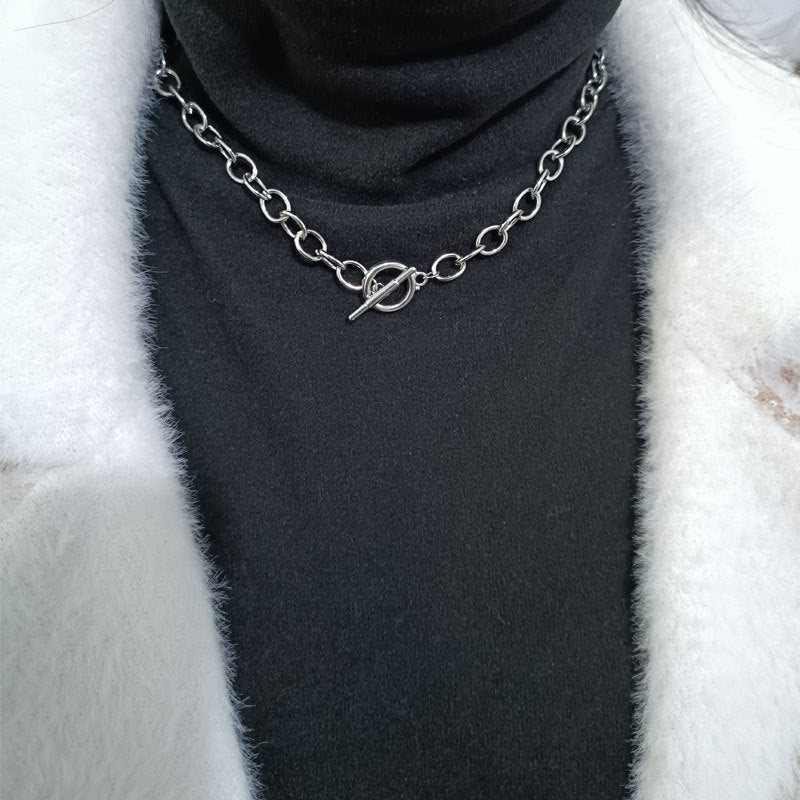 Modern women's elegant gold-tone chain necklace, a contemporary statement piece. Enhances any outfit.