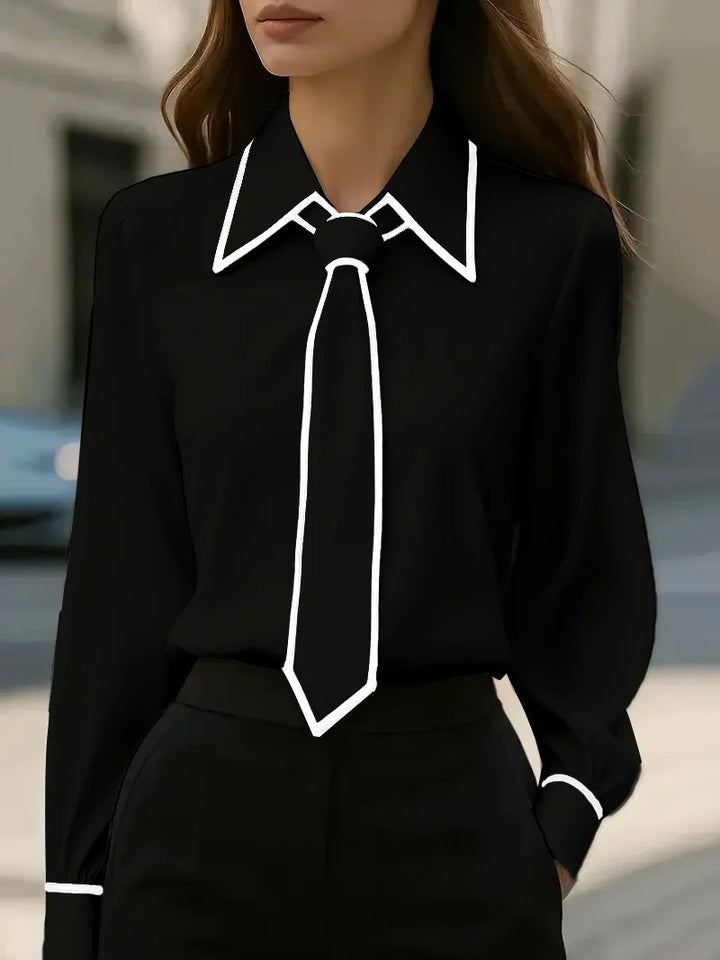 Versatile women's smart casual blouse. Features a statement oversized collar and stylish contrast tie neck.