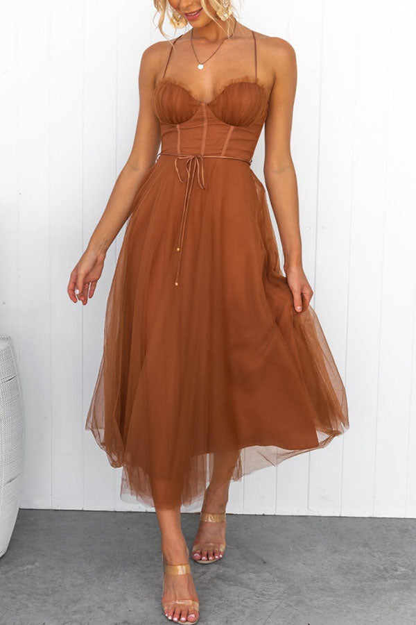 Feminine corset midi dress with a graceful tulle skirt, perfect for special events.