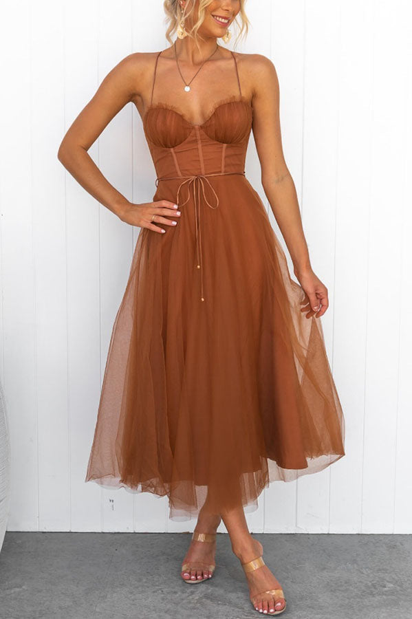 Graceful wedding guest dress: women's corset midi with a romantic tulle skirt.