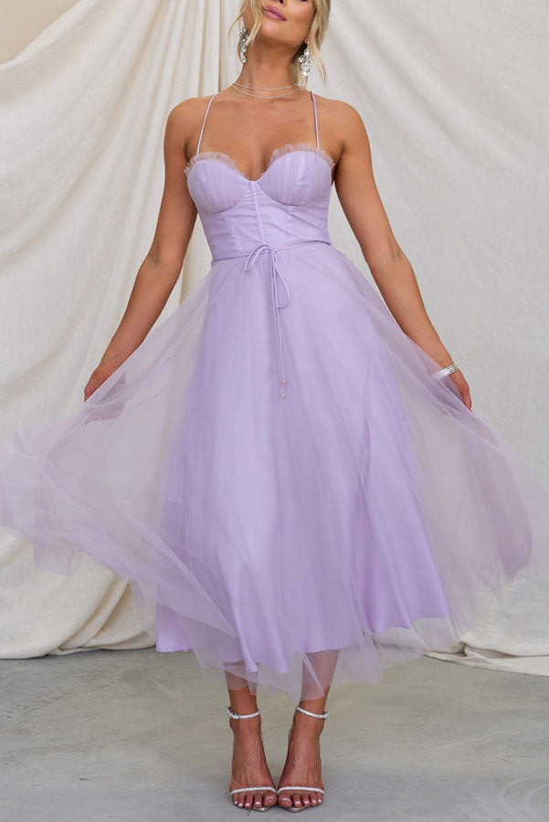 Women's cocktail party dress, elegant corset top and a charming tulle midi skirt.