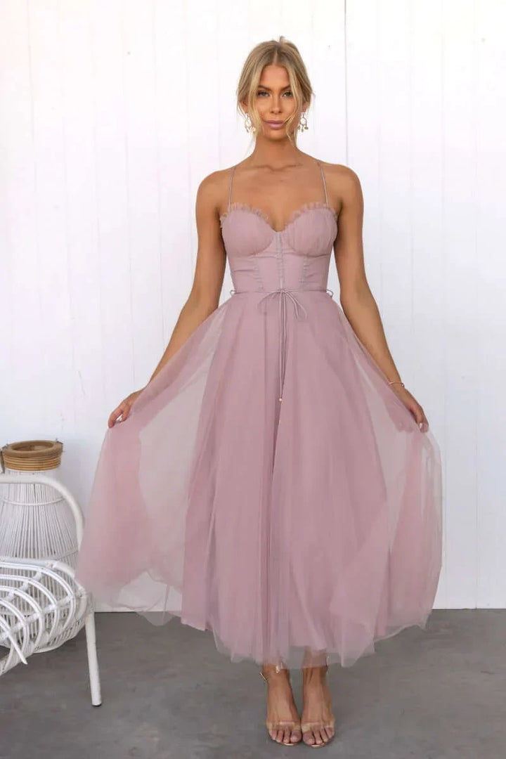 Beautiful corset midi dress featuring a delicate tulle skirt, ideal for wedding guests.