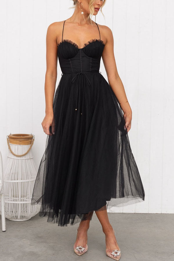 Summer elegant dress: women's corset midi with a light, airy tulle skirt.