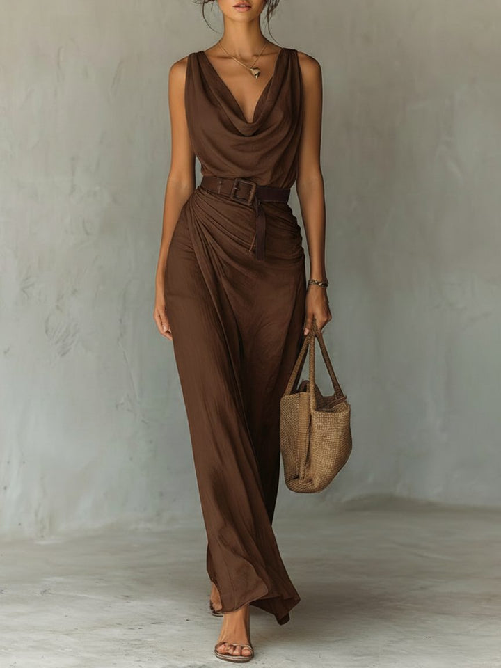 Elegant women's cowl neck belted maxi dress for summer or evening. Flowing sleeveless design, perfect for holiday wear.