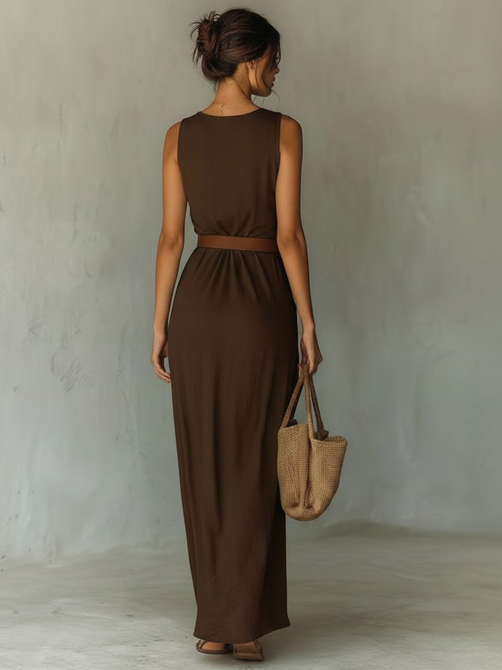 Close-up of elegant women's cowl neck maxi dress, highlighting soft fabric and stylish belted waist detail.