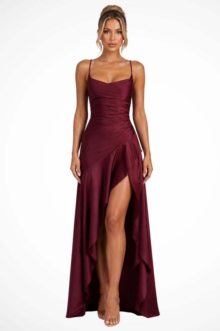 Flowy maxi wedding guest dress, a sleeveless cowl neck slip style.