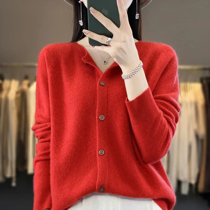 Elegant women's cardigan with a classic crew neck and button-front closure. Comfortable long-sleeve top.