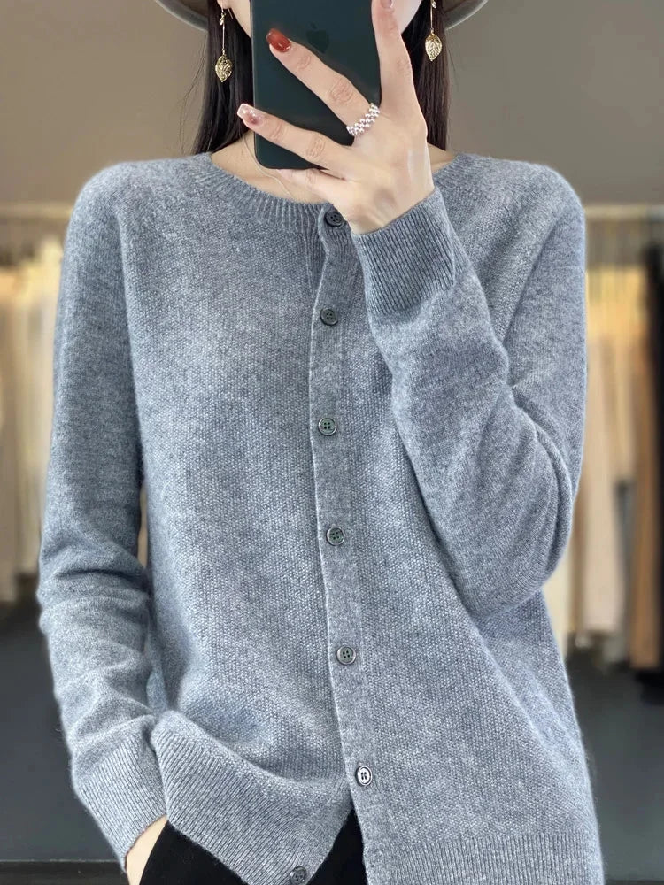 Women's long-sleeve crew-neck cardigan sweater. Button-up front offers versatile styling for all seasons.