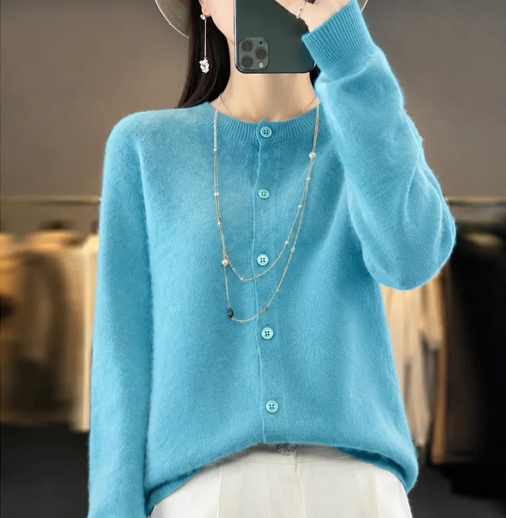 Black women's crew-neck button-front cardigan. Elegant long-sleeve sweater for a sophisticated outfit.