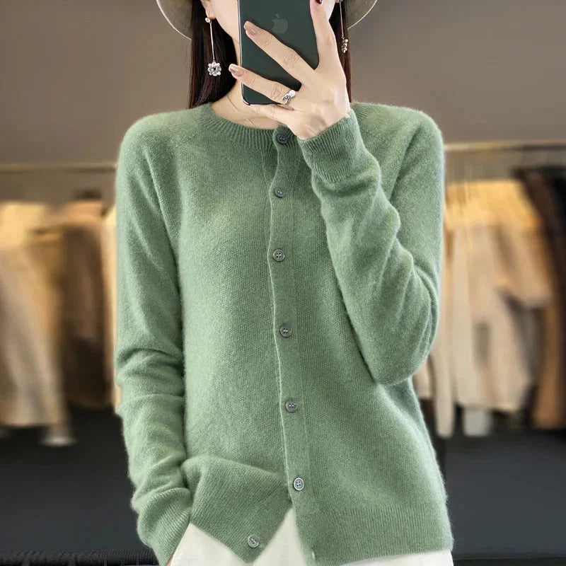 Cream women's elegant crew-neck cardigan. Button-up sweater, perfect for spring or fall layering.