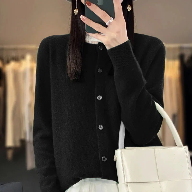 Women's crew-neck button-up cardigan, ideal for a layered look. Elegant long-sleeve sweater for any season.