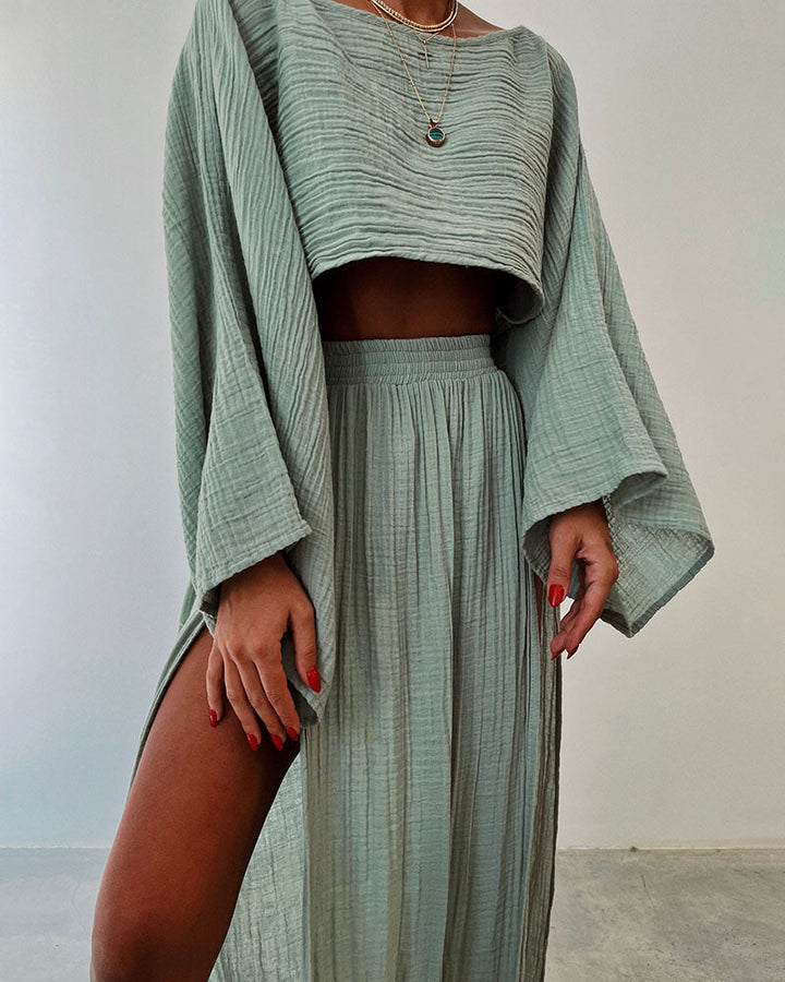 Chic women's crop top from an elegant two-piece set, paired with a side-split maxi skirt for summer.