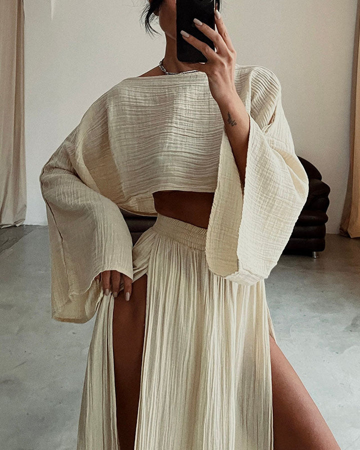 Elegant women's two-piece set featuring a sophisticated crop top and a flowing side-split maxi skirt.