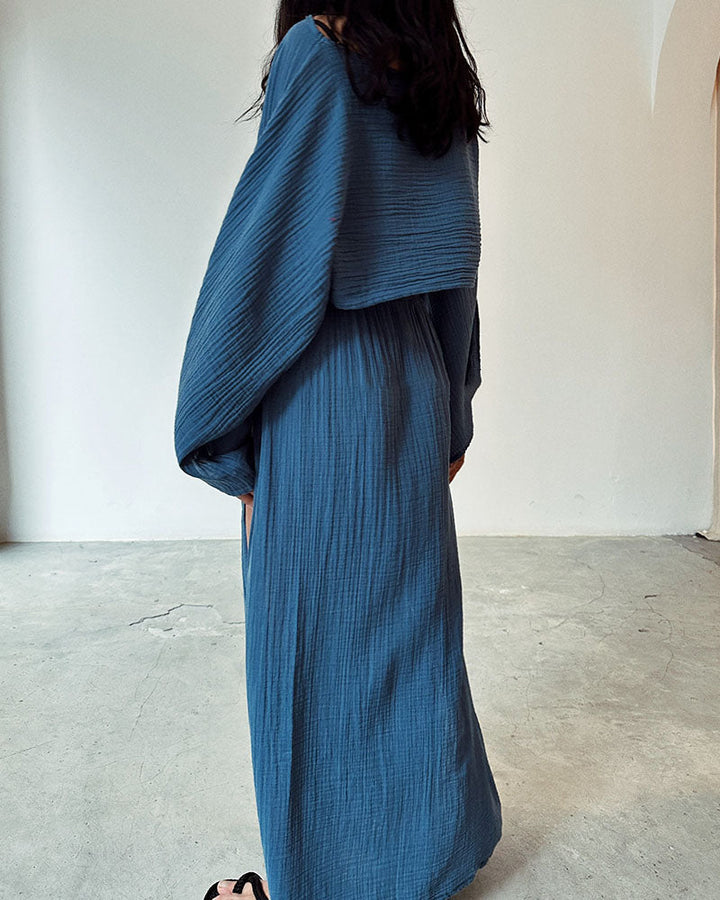 Fashionable women's elegant crop top and side split maxi skirt set. A chic and versatile two-piece ensemble.