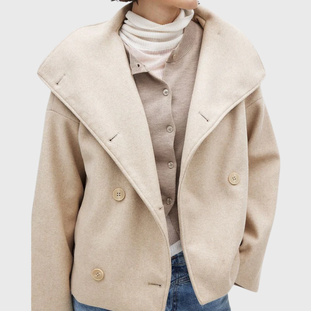 Fashionable women's cropped double-breasted jacket. Elegant outerwear, ideal for fall and winter style.