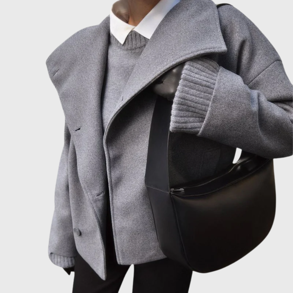 Chic women's cropped double-breasted coat. Structured fall jacket for elegant winter outerwear fashion.