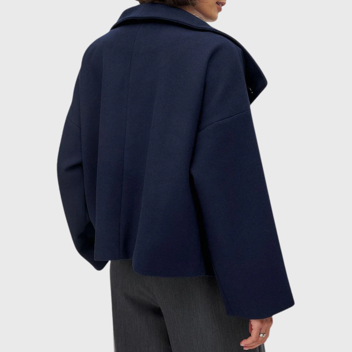 Modern women's cropped double-breasted coat. Chic and structured outerwear, ideal as a fall jacket.