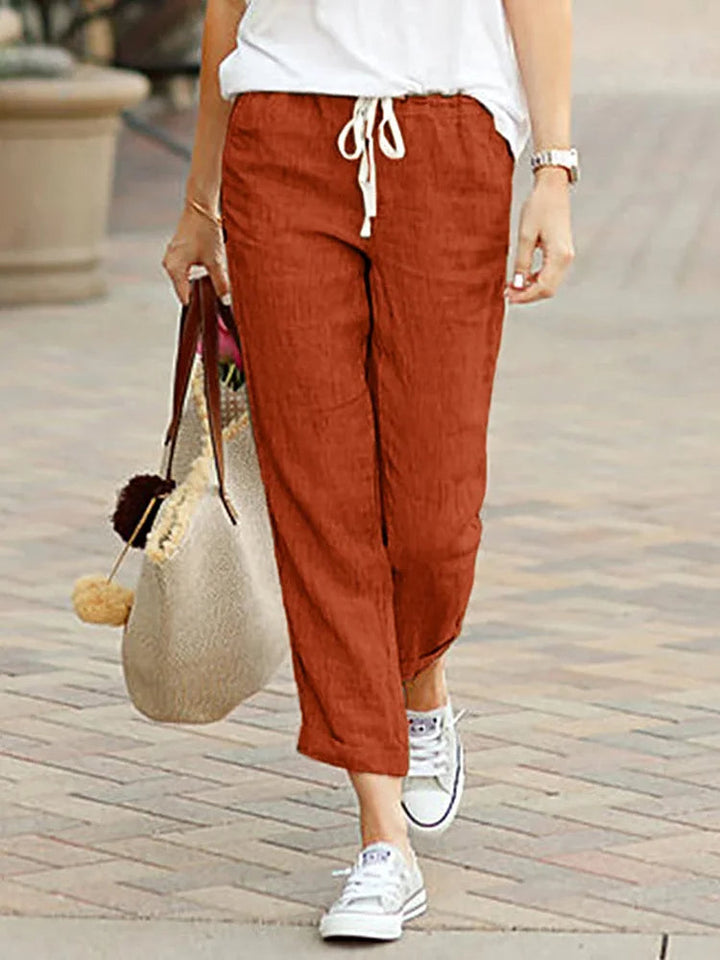 Modern women's elegant cropped trousers. Loose-fit polyester pants for comfortable, stylish all-season wear.