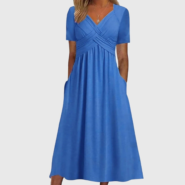 Women's cross-front A-line midi dress. Features tummy control, short sleeves, and flattering fit for all seasons.