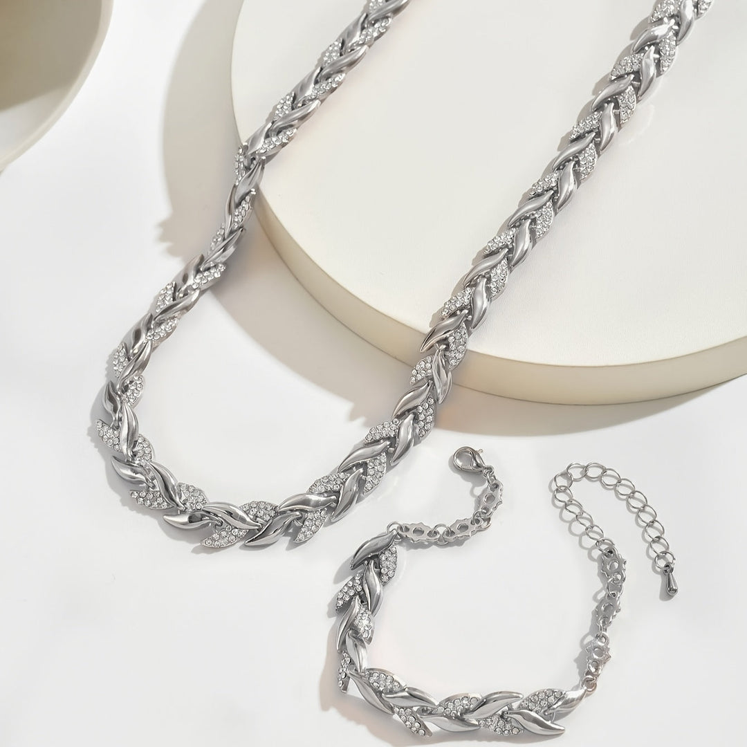 Women's elegant rose gold chain necklace with crystal leaf charm and matching bracelet. Dazzling set.