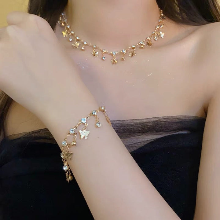 Elegant women's crystal necklace & leaf design bracelet set, perfect delicate accessory for parties or gifts.