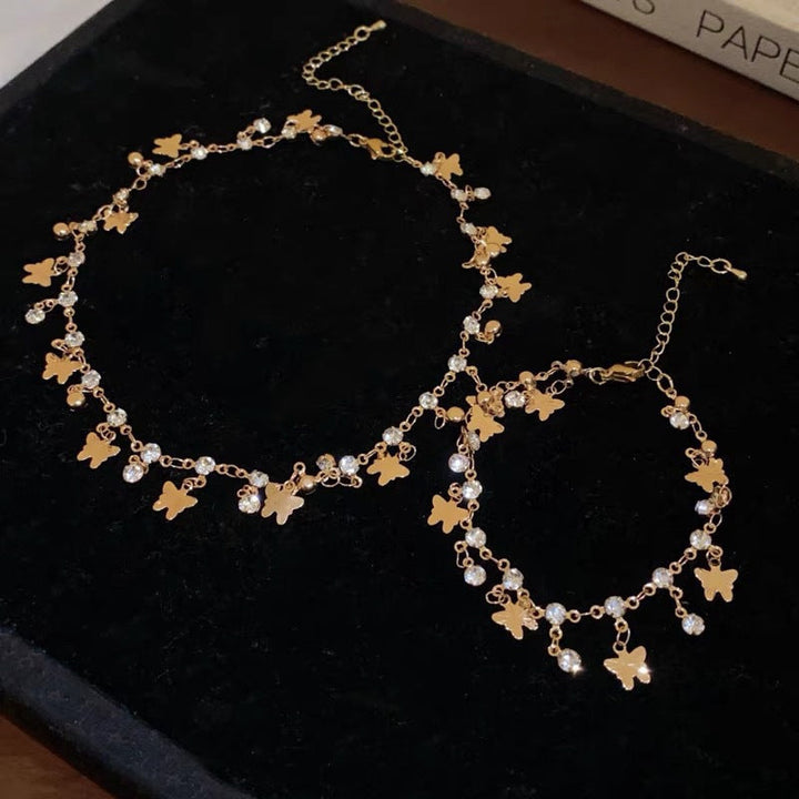 Close-up of elegant leaf design crystal necklace and bracelet, sophisticated women's fashion jewelry.