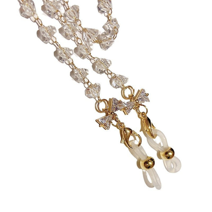 Close-up of a glistening crystal pendant on an elegant women's necklace, highlighting its intricate jewelry sparkle.