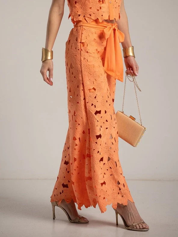 Beautiful women's two-piece set featuring a stunning cutout lace top & classic wide-leg trousers.