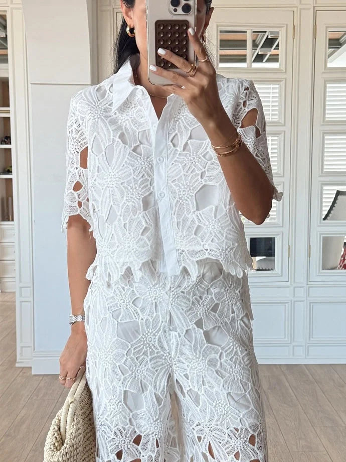 Fashionable women's party wear co-ord set: cutout lace shirt & sophisticated wide-leg trousers.