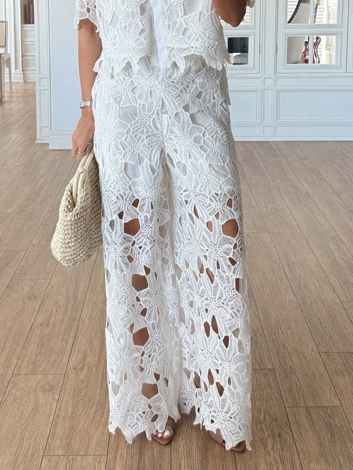 Sophisticated women's formal wear: lace long-sleeve top & high-waisted wide-leg trousers set.