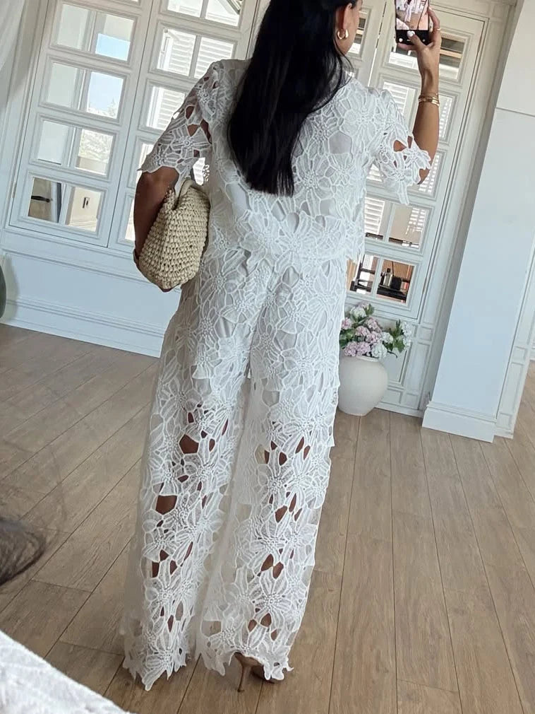 Detailed cutout lace shirt & flattering wide-leg trousers, a modern women's fashion two-piece set.