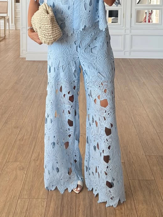 Comfortable & elegant women's co-ord set: cutout lace top & wide-leg trousers for versatile styling.