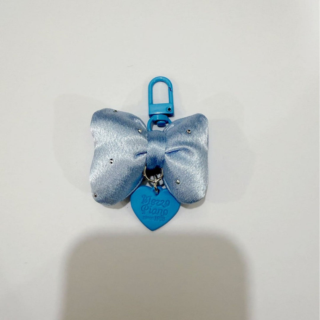 Decorative bow bag charm keychain for women, an elegant and colorful accessory for any purse or set of keys.