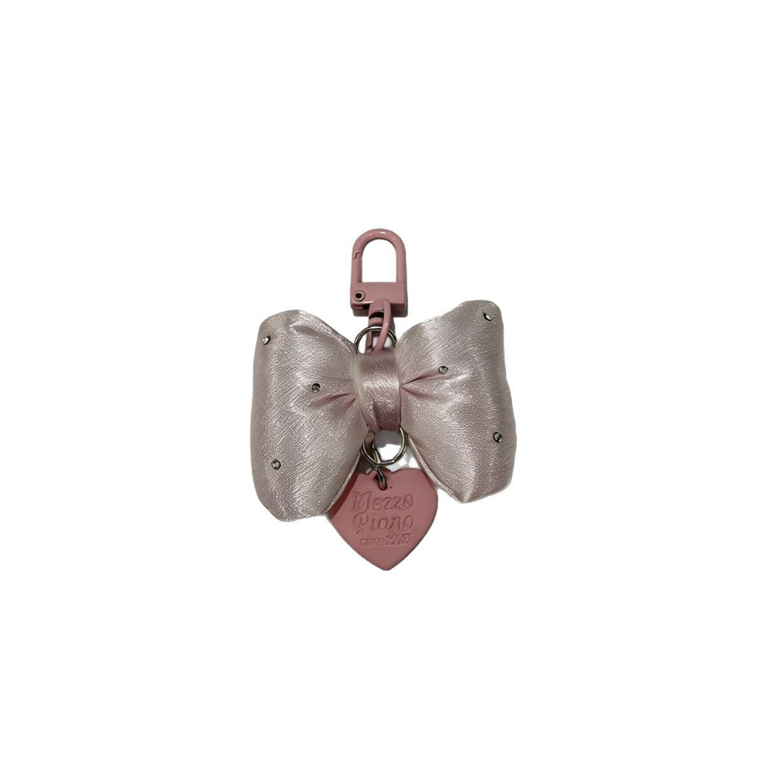 Stylish large fabric bow keychain for women, an elegant decorative accessory for bags or keys.