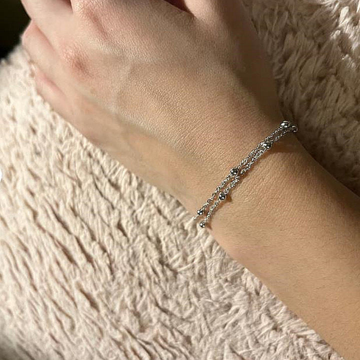 Delicate silver & gold tone chain bracelet for women, an elegant accessory for any occasion.
