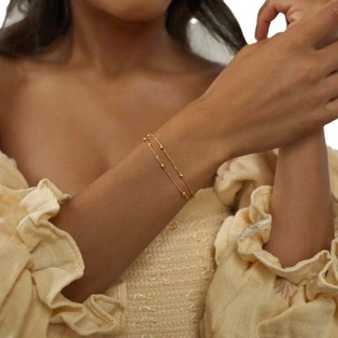 Beautiful delicate chain bracelet for women, featuring elegant silver and gold tones.