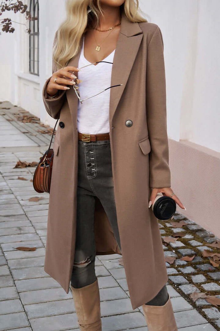 Sophisticated double-breasted long coat for women, ideal for elegant fall & winter fashion.