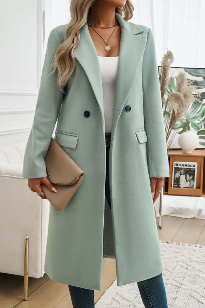 Women's elegant long coat, double-breasted, perfect for sophisticated fall outerwear.