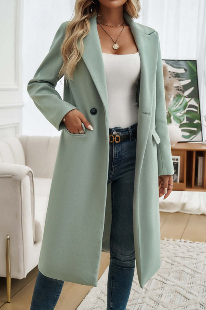 Classic women's long double-breasted coat, sophisticated for fall & winter layering.