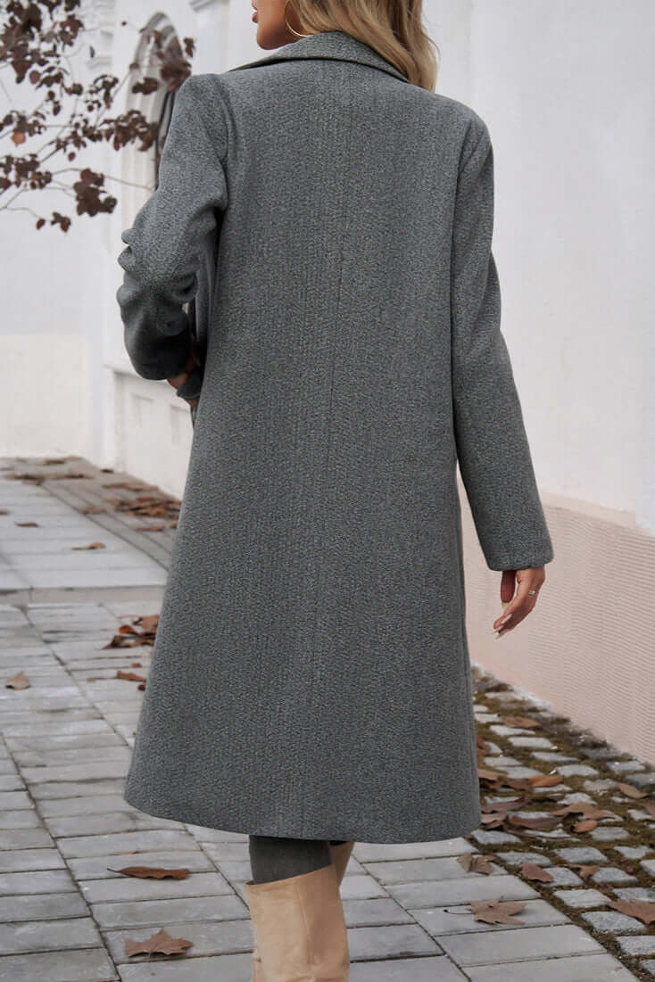 Women's elegant double-breasted long coat, stylish winter outerwear for a chic vibe.
